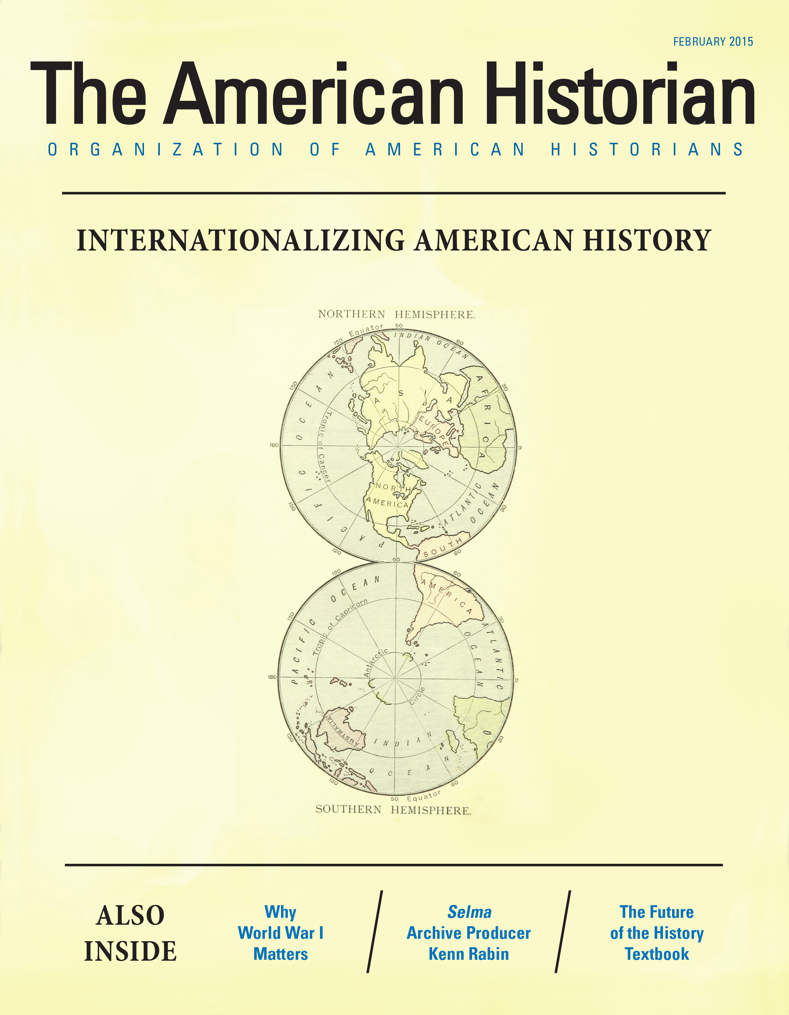 This issue's cover shows 2D globes against a yellow background and the title 
