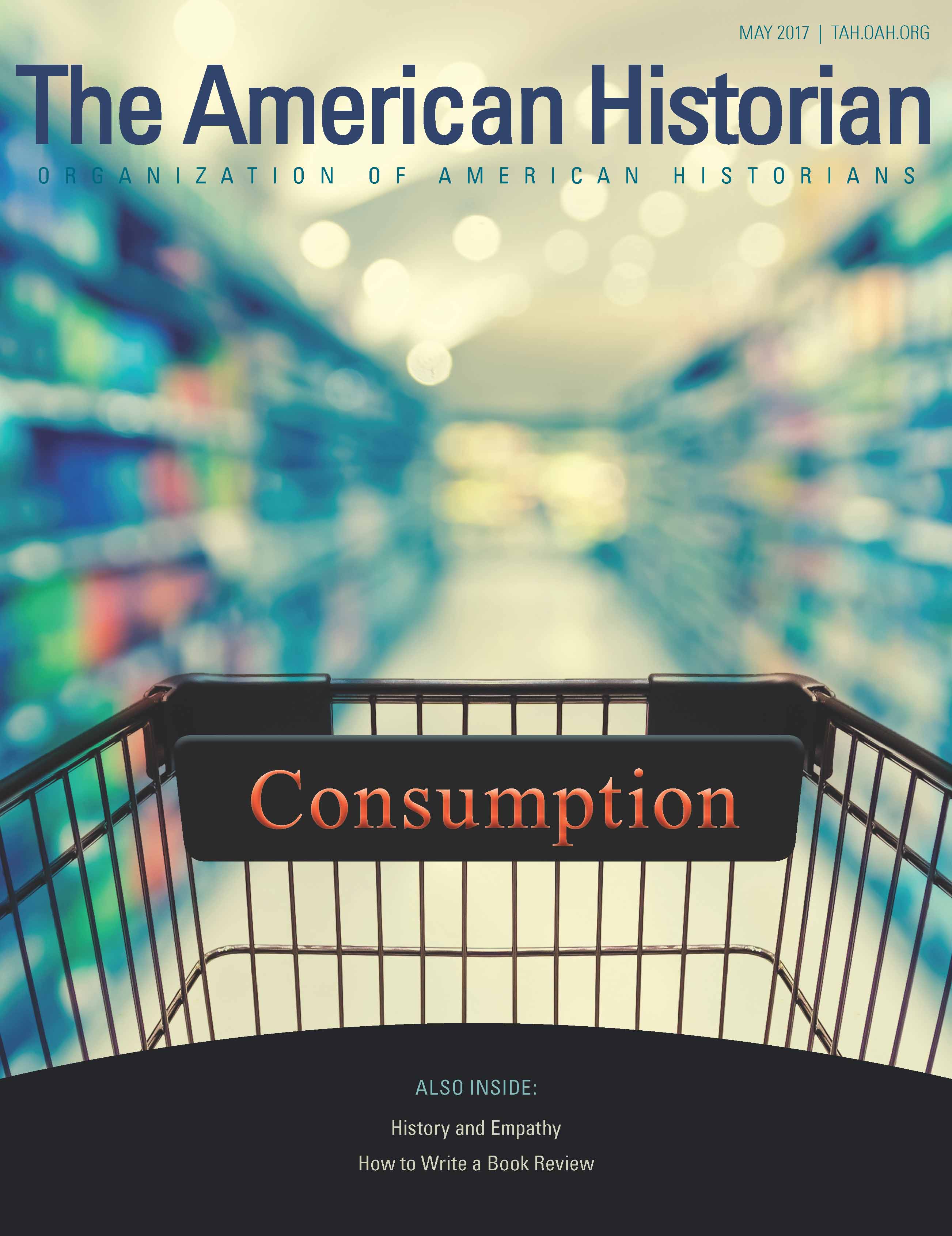 This issue's cover is of a shopping cart in the isle of a store with the title 