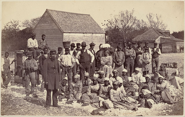a group photograph of a large group of enslaved individuals