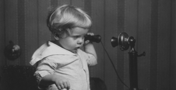 A child using a telephone