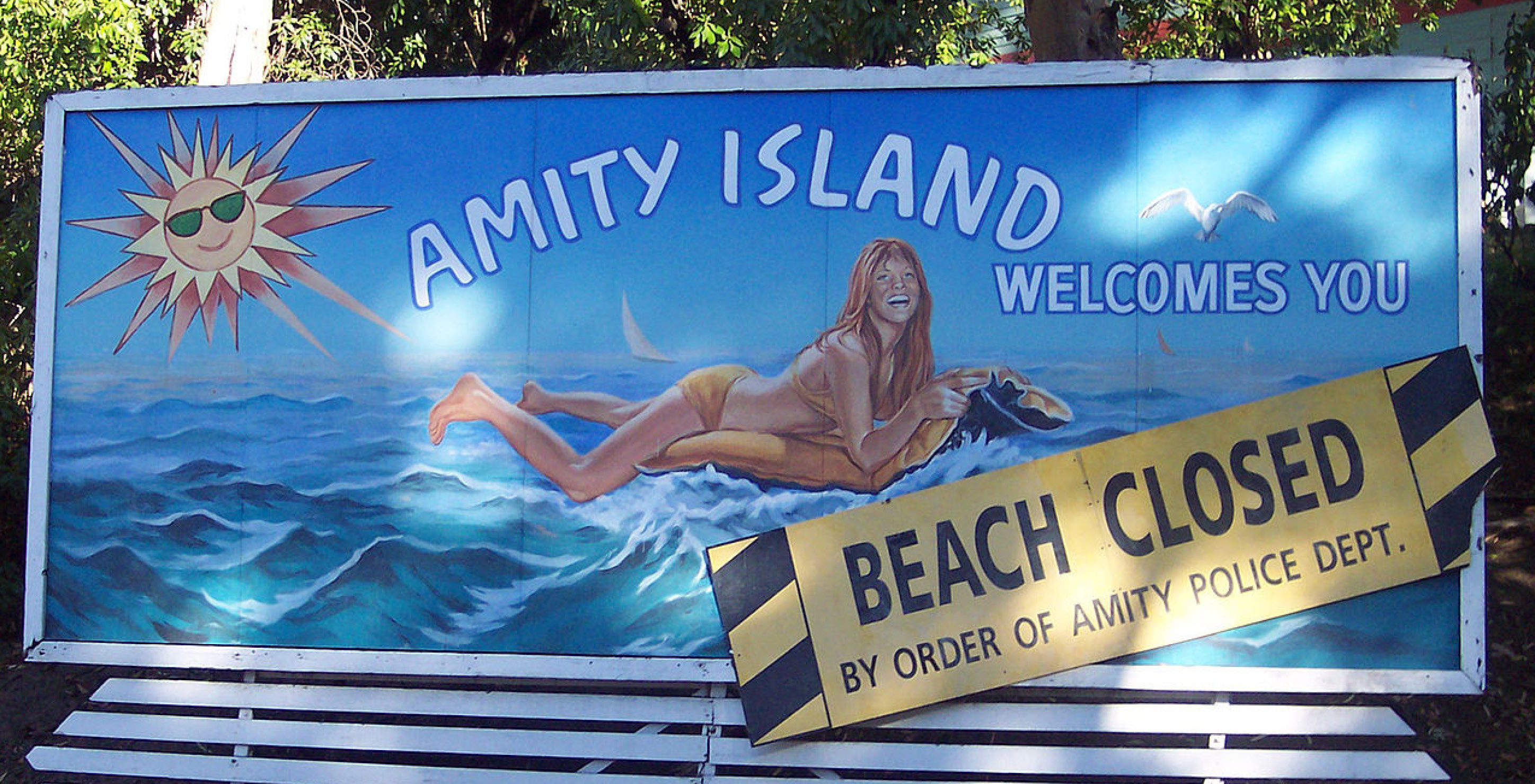 Billboard from Jaws theme park ride which reads 'Amity Island welcomes you'